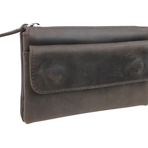 May include: A brown leather wallet with a zipper closure and a large flap pocket.