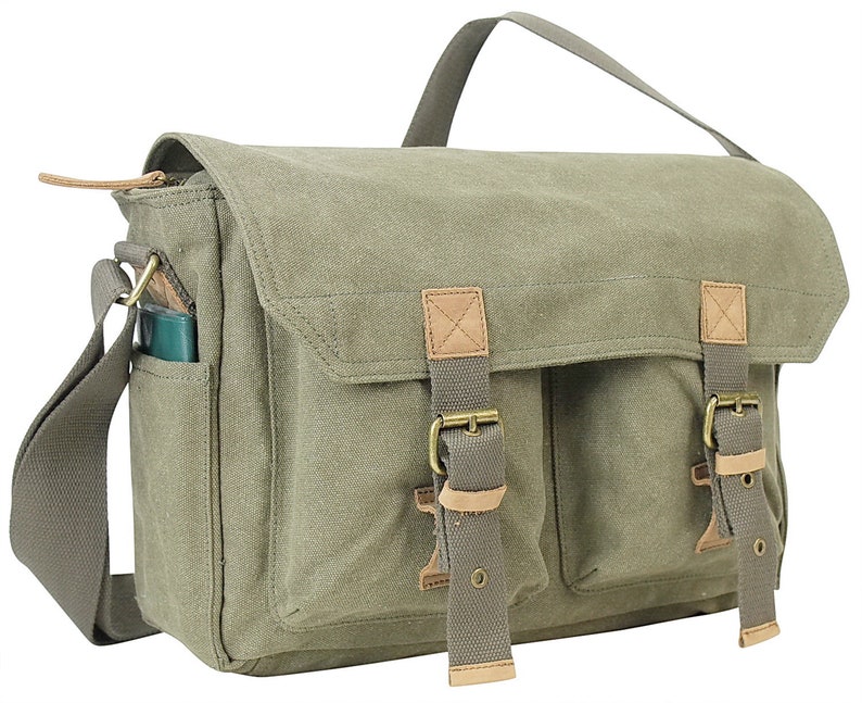 May include: A green canvas messenger bag with brown leather accents and two adjustable straps with buckles. The bag has a zippered closure and a front pocket.