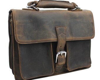 May include: A brown leather briefcase with a buckle closure and a top handle. The briefcase has a distressed look and is made of high-quality leather.