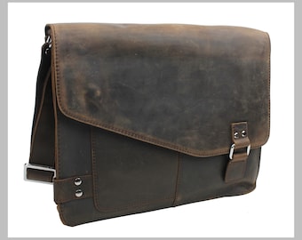 May include: A brown leather messenger bag with a flap closure and a buckle. The bag has a distressed look and a worn appearance.