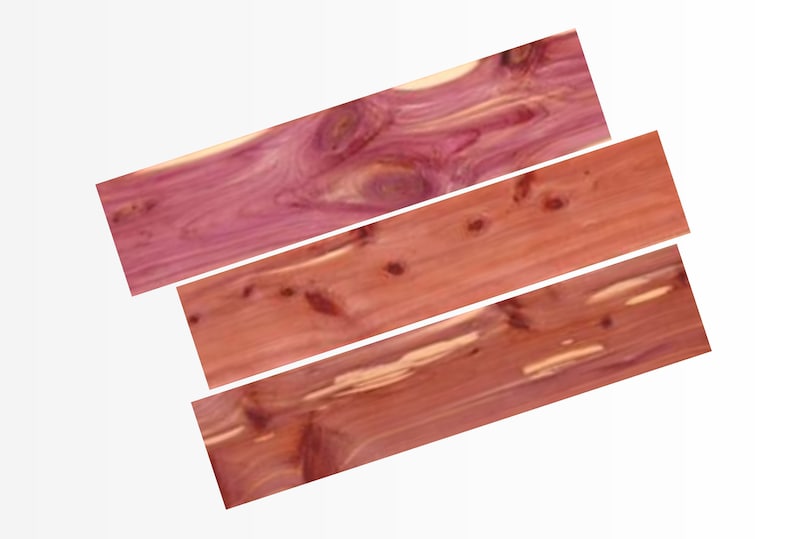 May include: Three pieces of cedar wood with a reddish-brown color and a natural wood grain pattern.
