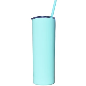 May include: A tall, light blue insulated tumbler with a matching straw. The tumbler has a sleek, cylindrical design and a silver-colored lid. The straw is inserted into the lid, ready for use. The tumbler is designed to keep drinks cold.
