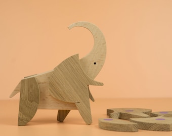 Wooden elephant puzzle with pink magnets