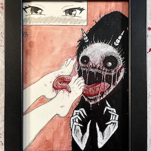 May include: Framed artwork featuring a black and white illustration of a monster with sharp teeth and horns, with a pair of feet with pink toenails. The artwork is set against a pink background, with anime-style eyes in the upper left corner.