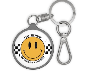 Humorous Keyring Tag  "I Can't Fix Stupid, But I Can Put a Cast On It" Funny Gift, Keychain, Novelty Token, Car Accessory, Humor [...]