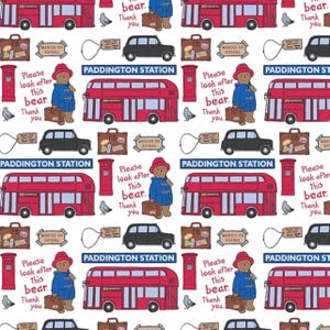 May include: A repeating pattern featuring Paddington Bear, red double-decker buses, black cars, suitcases, and post boxes. Text includes "Paddington Station", "Please look after this bear. Thank you," and "Wanted on Voyage."