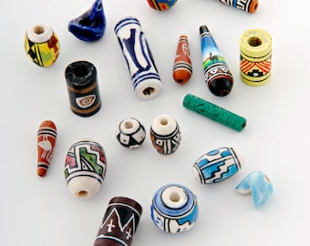 Hand painted clay ceramic beads x 50 mixed shapes, colours, sizes. Hand made and painted in Peru by artisans in Cuzco and fairtrade (bp599b)