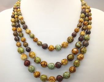 A Scottish/Celtic style graduated triple row vintage jewelry necklace made with mottled mixed colour Murano agate type beads and spacers