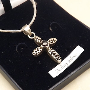 A superb chunky 925 silver vintage jewelry cross with heavy snake chain made in very fancy open work and set with a garnet in the center