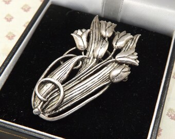 A MASJ - Maureen Ann Story-Jones hand made tulips design vintage jewelry brooch made in raised openwork silver on pewter