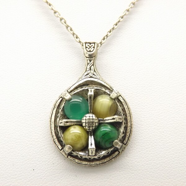 A lovely Scottish / Celtic round design vintage jewelry pendant and chain in antiqued silvertone metal with mixed green faux agate stones