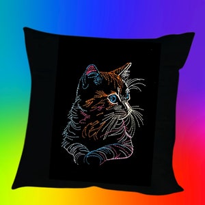 May include: A black pillow with a colorful embroidered image of a cat looking to the right. The cat's fur is orange, brown, and white, and its eyes are blue.