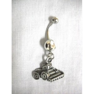 May include: Silver belly button ring with a charm of a small tractor.