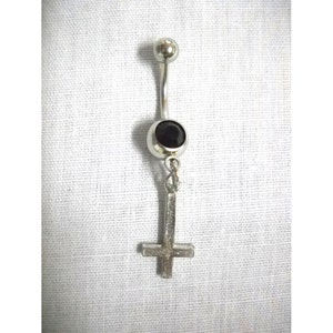 May include: Silver body piercing with a black gem and a silver upside down cross charm.