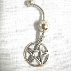 May include: Silver belly button ring with a pentagram charm.