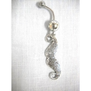 May include: Silver belly button ring with a dangling mustache charm.