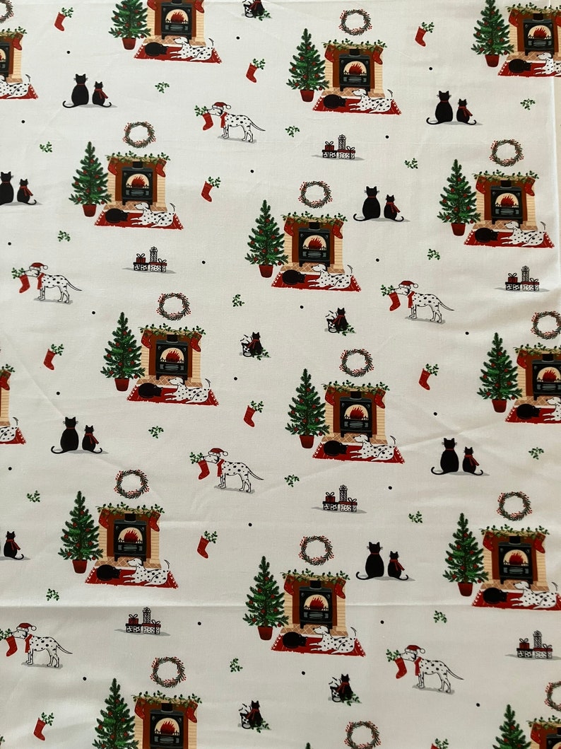 Dalmatian Dog Christmas fabric , features dogs and cats lying by a Christmas fireplace. Far away view.