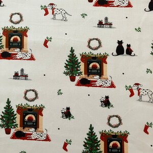 Dalmatian Dog Christmas fabric , features dogs and cats lying by a Christmas fireplace