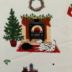 Dalmatian Dog Christmas fabric , features dogs and cats lying by a Christmas fireplace. Up close view.
