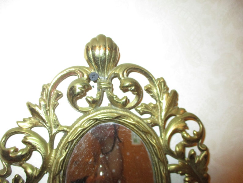 Solid brass mirrored electric wall sconce