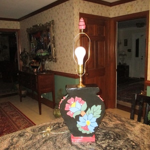 handcrafted black ceramic table lamp base with flowers