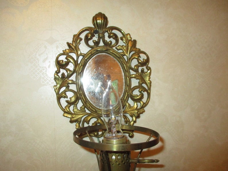 Solid brass mirrored electric wall sconce