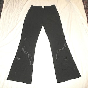 Pantalones elásticos de corte acampanado con cuentas de Cache