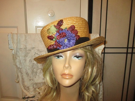 Straw boater hat with berries and purple flower - image 1