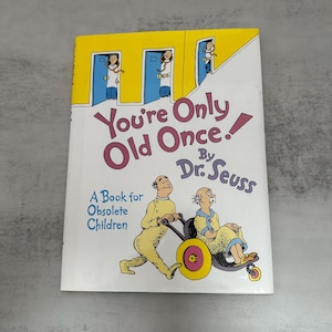 May include: A hardcover book titled "You're Only Old Once!" by Dr. Seuss. The cover features illustrations of elderly characters and the text "A Book for Obsolete Children". The book has a yellow border.
