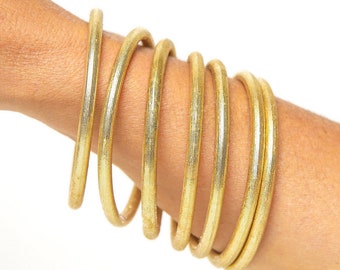 Stacked bracelets, gold bangles in 2 sizes to be used alone or to match African printed bracelets