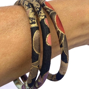 Gold Japanese bracelet, a chic piece of jewelry in fabric with print on a black, red and gold colors, a chic bracelet for christmas
