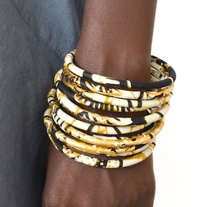 African wax bracelets assorted in a set of 3 ethnic bangles in Ankara print black/ecru/orange/gold