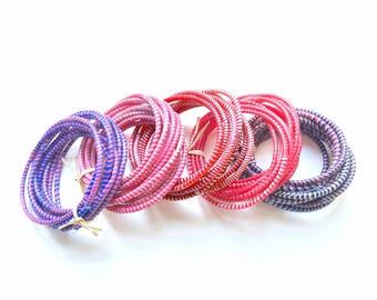 African bracelets in recycled plastic or lot of fine waterproof rushes for the summer, a chic ethnic jewel in several colors pink tones