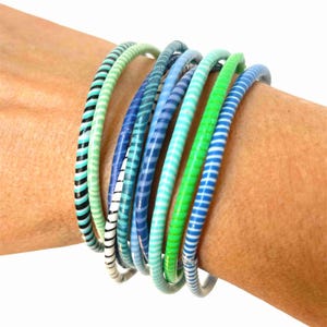 Waterproof bracelets in packs of 10 made from recycled flip-flop plastic, pretty recycled bracelets in ocean colors for summer