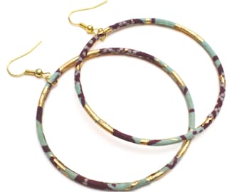 African creoles or large hoop earrings with golden ankara fabrics and sky blue