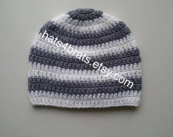May include: Gray and white striped crocheted beanie hat.