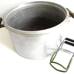 May include: A set of three ceramic mugs with a speckled, cream-colored glaze. Each mug features a different hand-painted floral design in shades of blue, green, and yellow. The mugs have a simple, rounded shape and a comfortable handle.