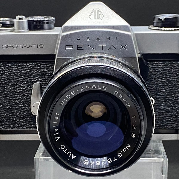 Good Pentax Spotmatic SP 35mm film camera body with vivitar 35mm f2.8 wide-angle lens.