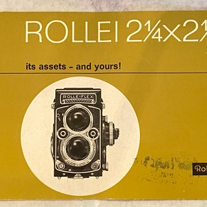 May include: A yellow pamphlet with the text "ROLLEI 2 1/4 x 2 1/4" in large black letters. The pamphlet advertises a Rolleiflex camera with the text "its assets - and yours!" and a photo of the camera in a white circle.