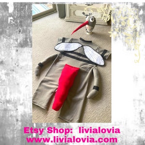 May include: A gray and white mosquito costume with red legs and a matching headpiece. The costume features wings and a striped body.