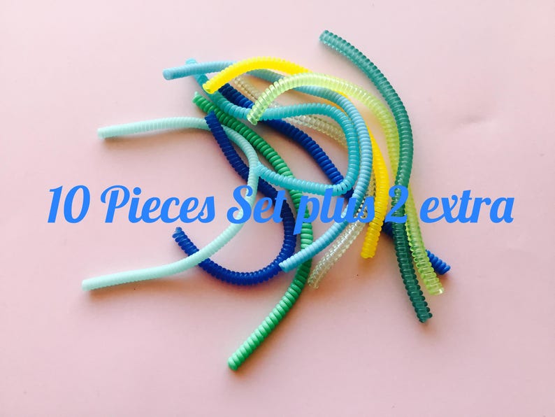 May include: A set of 10 colorful, coiled, plastic cord organizers with 2 extra organizers. The organizers are in shades of blue, green, and yellow.