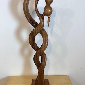 Kissing couple abstract wood sculpture