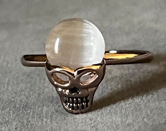 Gold Tone Ring Featuring a Skull with Whitish Stone, Adjustable