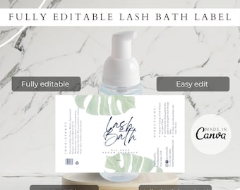 May include: A printable label for a lash bath product. The label features a green and white tropical leaf design with the text "Lash Bath" in blue script. The label also includes the text "Oil Free Vegan Friendly" and "Ingredients" and "Directions".