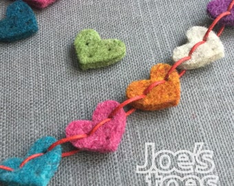 50 Mini-hearts in thick wool felt with punch holes for easy stitching. Adorable little trims for gifts and accessories.