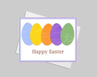 May include: A rectangular greeting card featuring five painted Easter eggs in light blue, yellow, orange, purple, and green arranged in a row. Below the eggs, the text Happy Easter is printed in a simple font. The card has a thin purple and blue border.