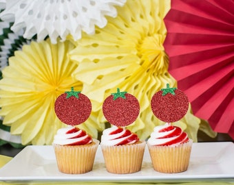 May include: Three cupcakes decorated with red and white frosting and topped with red glitter tomato cupcake toppers.