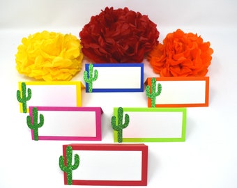 May include: Six place cards with a cactus design. The place cards are in different colors: yellow, pink, red, blue, green, and orange. Each place card has a blank space for writing a name.