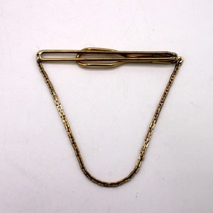 Goudkleurige tiebar met ketting van Swank