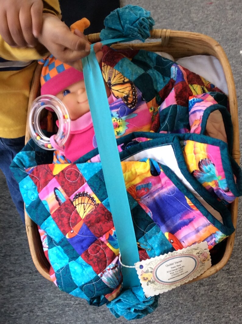 Handmade Doll quilt with Doll in a Moses basket. Etsy